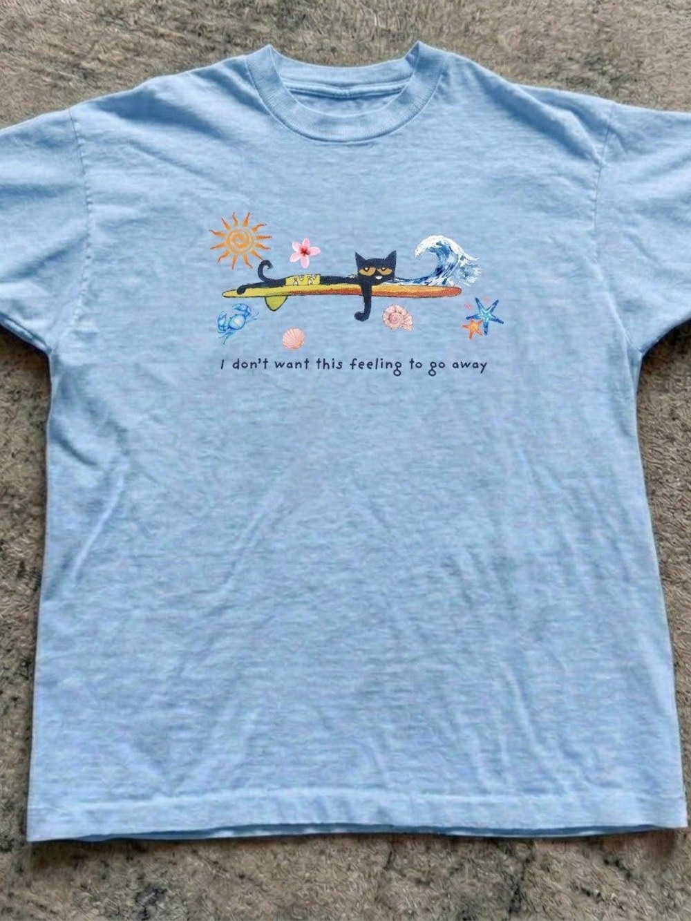 Gildan Light Blue Cat Surfboard Graphic Tee with Beach Motif